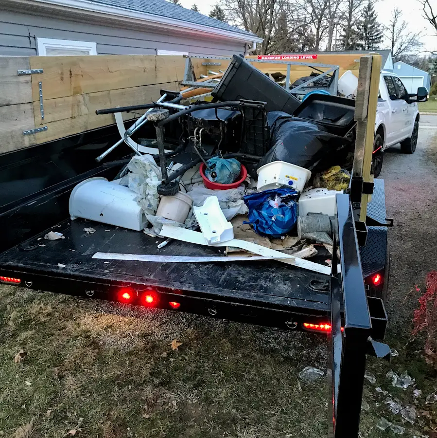 Roll-off dumpster delivered to a residential driveway in University